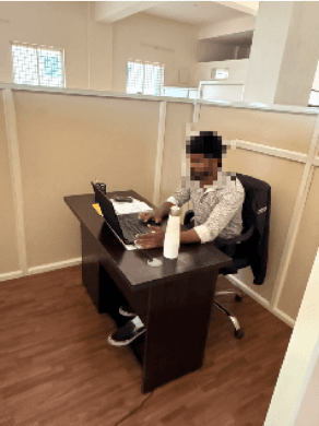 EvoGenix team member working at an office desk